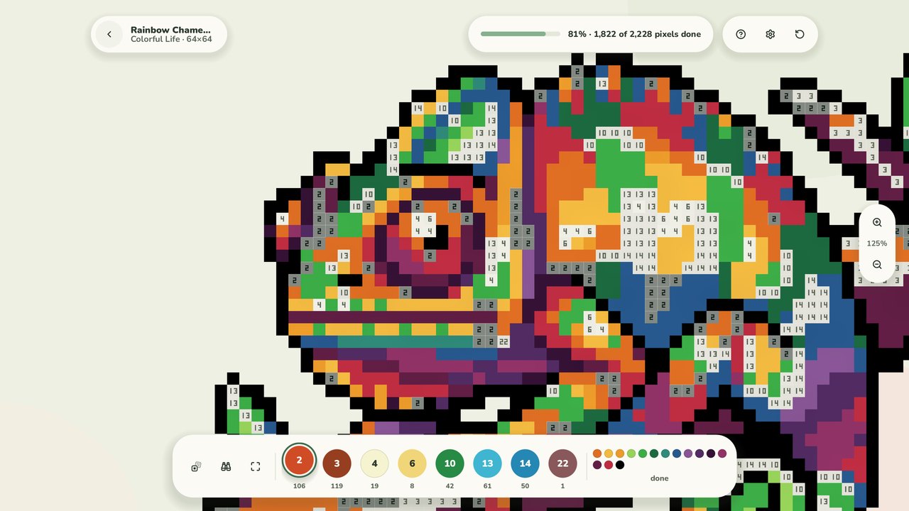 A rainbow chameleon, mostly painted, with numbered cells still open